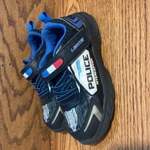 Boy size 12 sketcher light up shoe.
